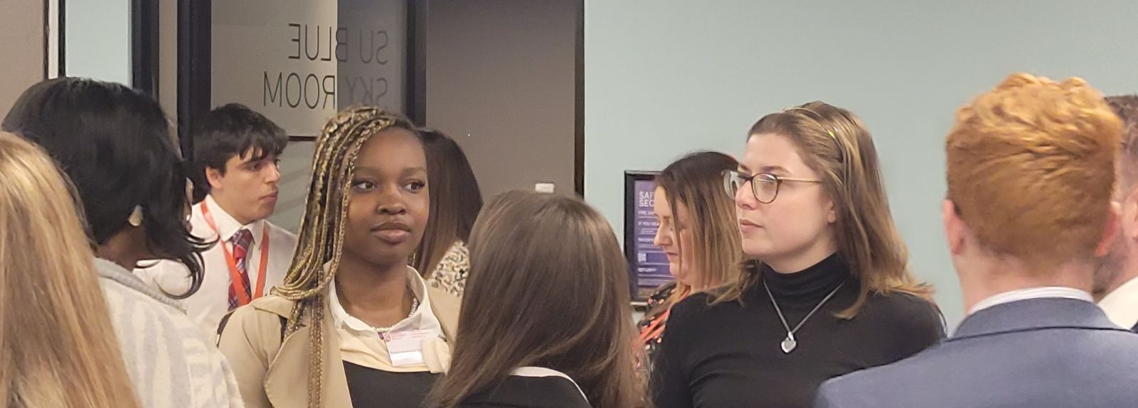 student networking in formal clothing